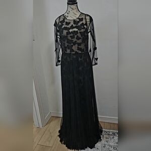 Marchesa Notte butterfly black dress with long sleeves.